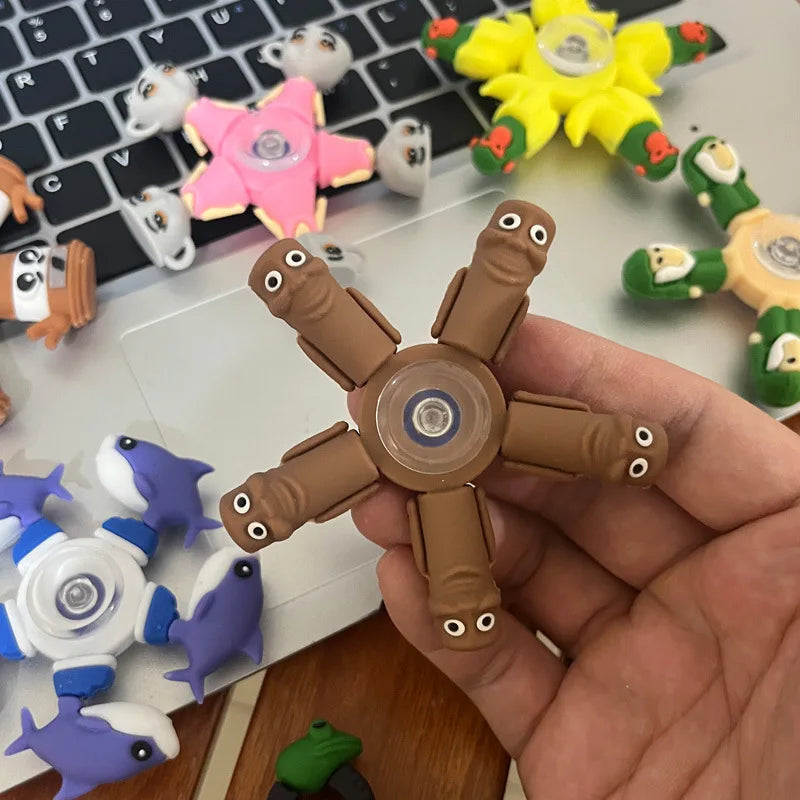 Brown fidget spinner held in a hand with colorful fidget spinners in the background on a laptop.